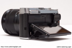 The X-M1's rear tilting LCD.  This position is at about 70% of maximum tilt.  When tilting for shooting low to the ground, you can actually tilt the screen slightly past 90 degrees.