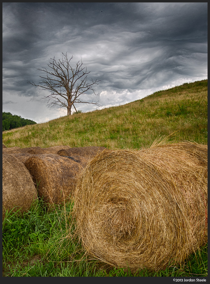 Hay Bales Under a Stormy Sky - Olympus OM-D E-M5 with Panasonic 14mm f/2.5