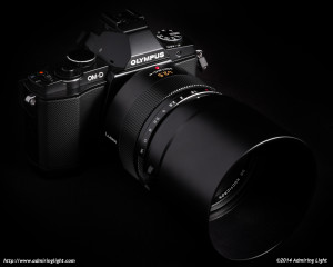 The Panasonic Leica 42.5mm f/1.2 Nocticron on the Olympus OM-D E-M5, with the included metal hood