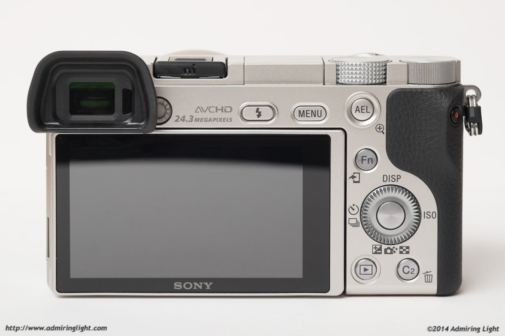 The rear of the a6000, with the host of programmable buttons, the rear dial and the tilting rear screen.