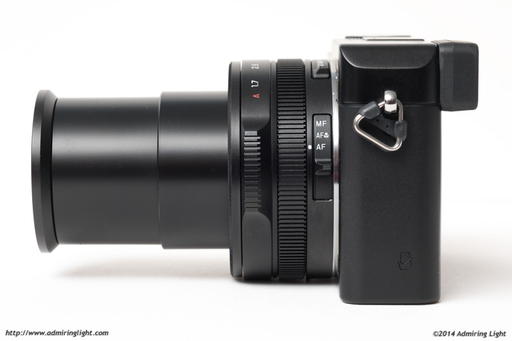 The focus switch can be seen along the lens barrel.  This image shows the lens at full extension at 34mm
