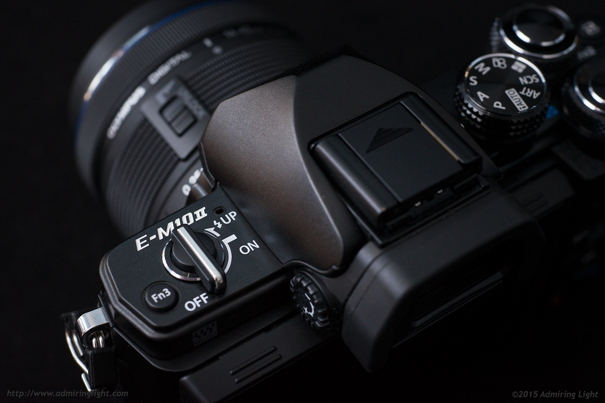 The power switch has moved to the left side of the camera and also controls the pop-up flash